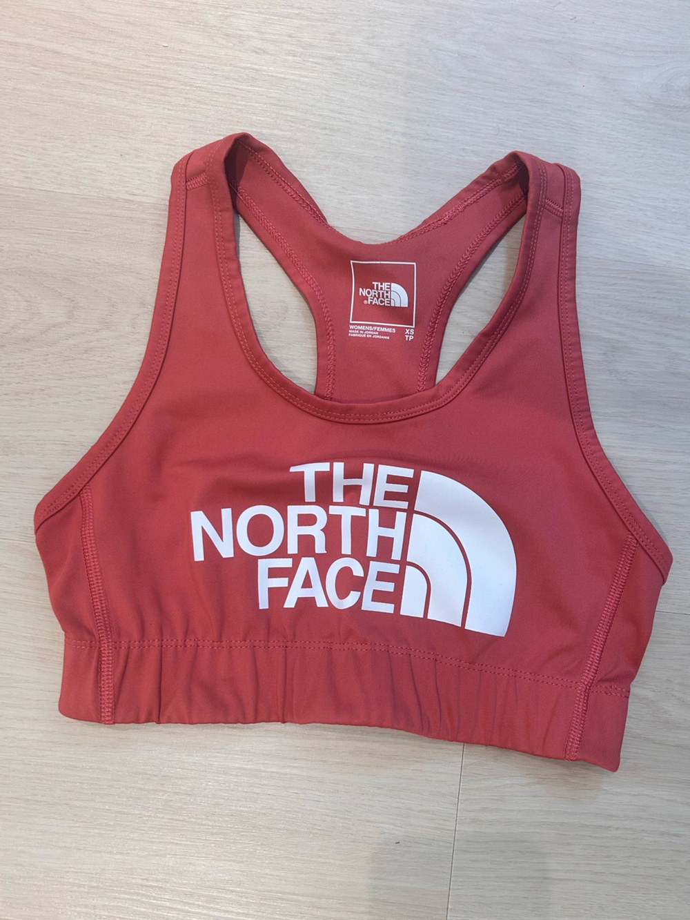 The North Face Red Racerback Sports Bra with White Logo